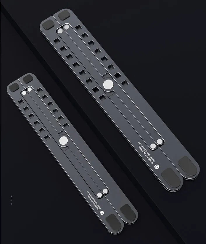 Aluminium foldable laptop stand in silver colour, shown open at an angle and folded flat.