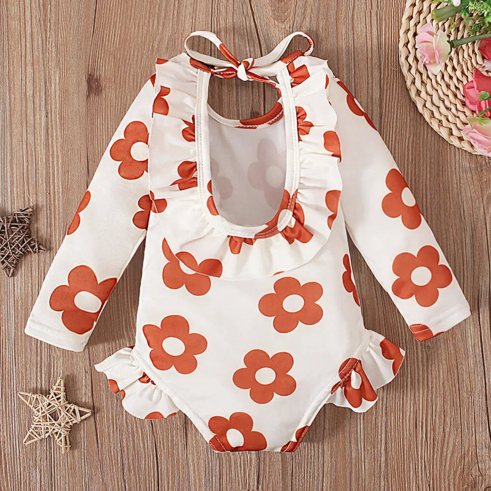 Girl's white floral print open back swimsuit with crew neck design and high-cut briefs