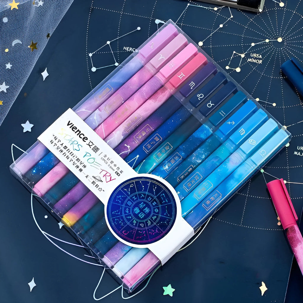 Twelve constellation zodiac ballpoint pens with bright star designs on plastic bodies, assorted colours, set of 12