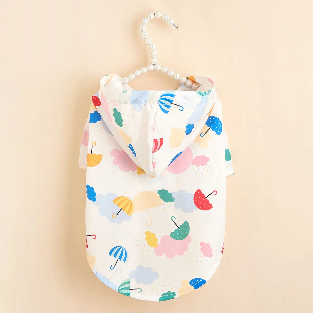 Colourful cartoon umbrella pattern dog raincoat in size L made from blue and yellow polyester.