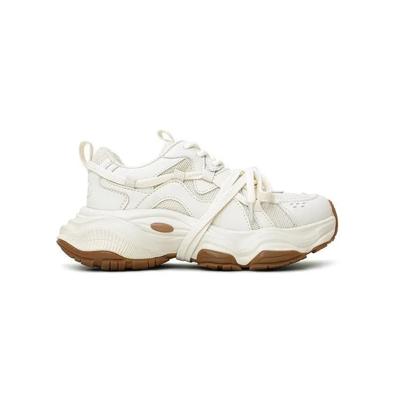 Beige women's platform heel dad sneakers with round toe and front lace-up fastening.