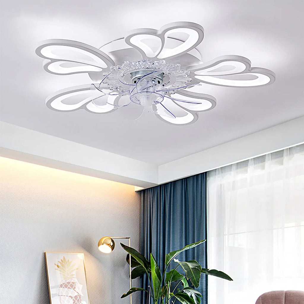 Modern white ceiling fan light with six-blade design and integrated light fitting on a room ceiling.