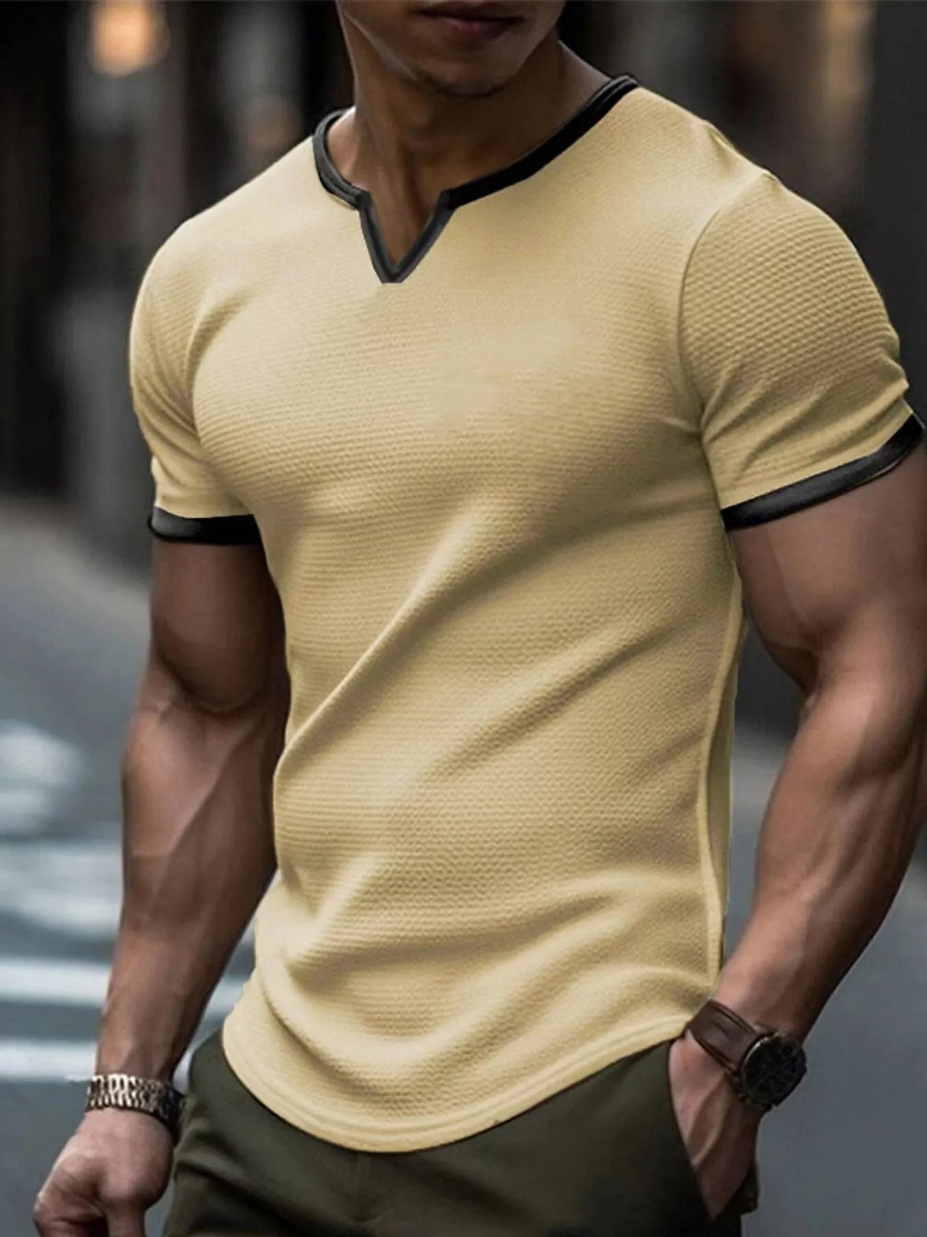 Colour-block V-neck short sleeve t-shirt in polyester waffle fabric on a neutral background.