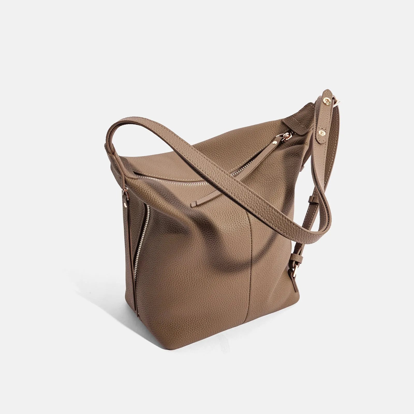 Soft genuine cowhide women's bucket shoulder bag in elephant grey, shown from the side.