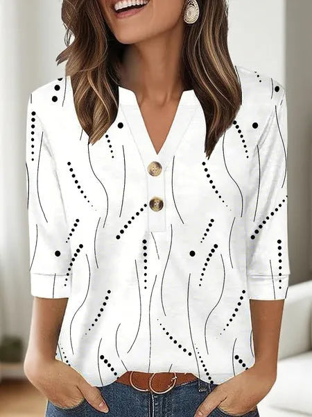 Women's loose-fit V-neck top with a blue 3D geometric pattern print, showcasing front view.