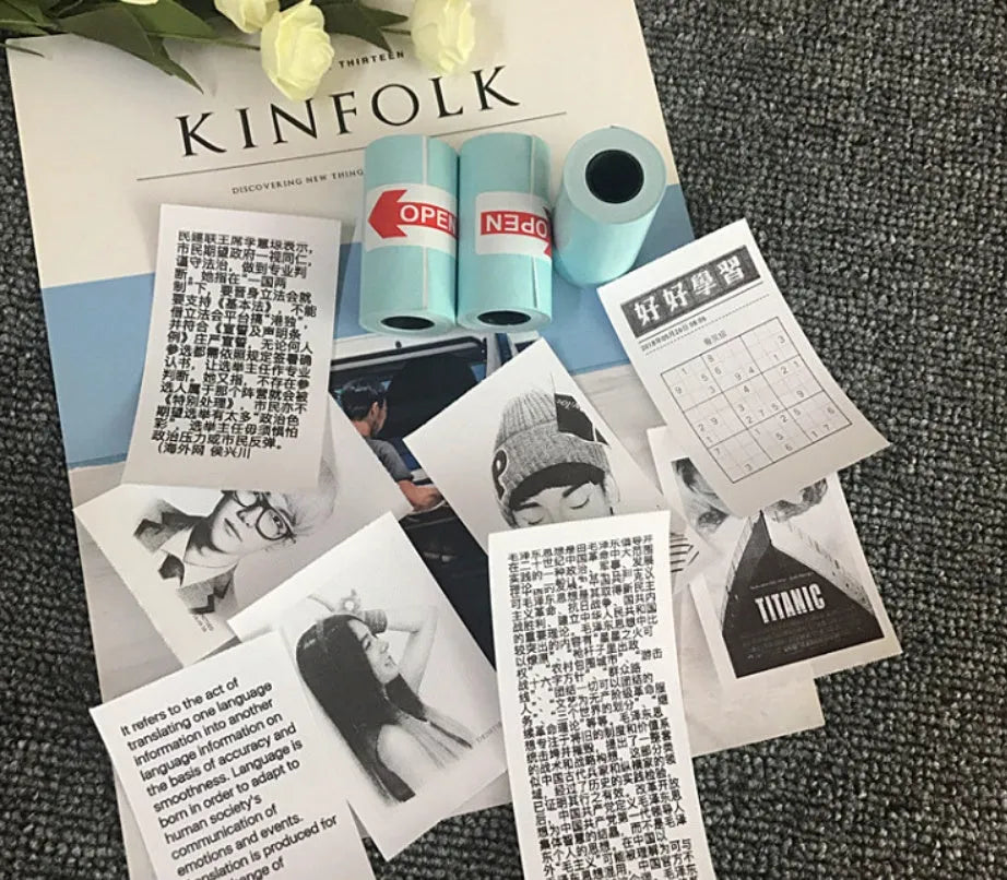 PerPage mini wireless portable thermal printer paper roll in multiple colours, showing label and sticker options