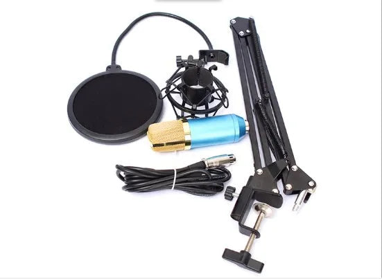 BM800 condenser microphone set in black with metal shock mount and cantilever bracket on a desk
