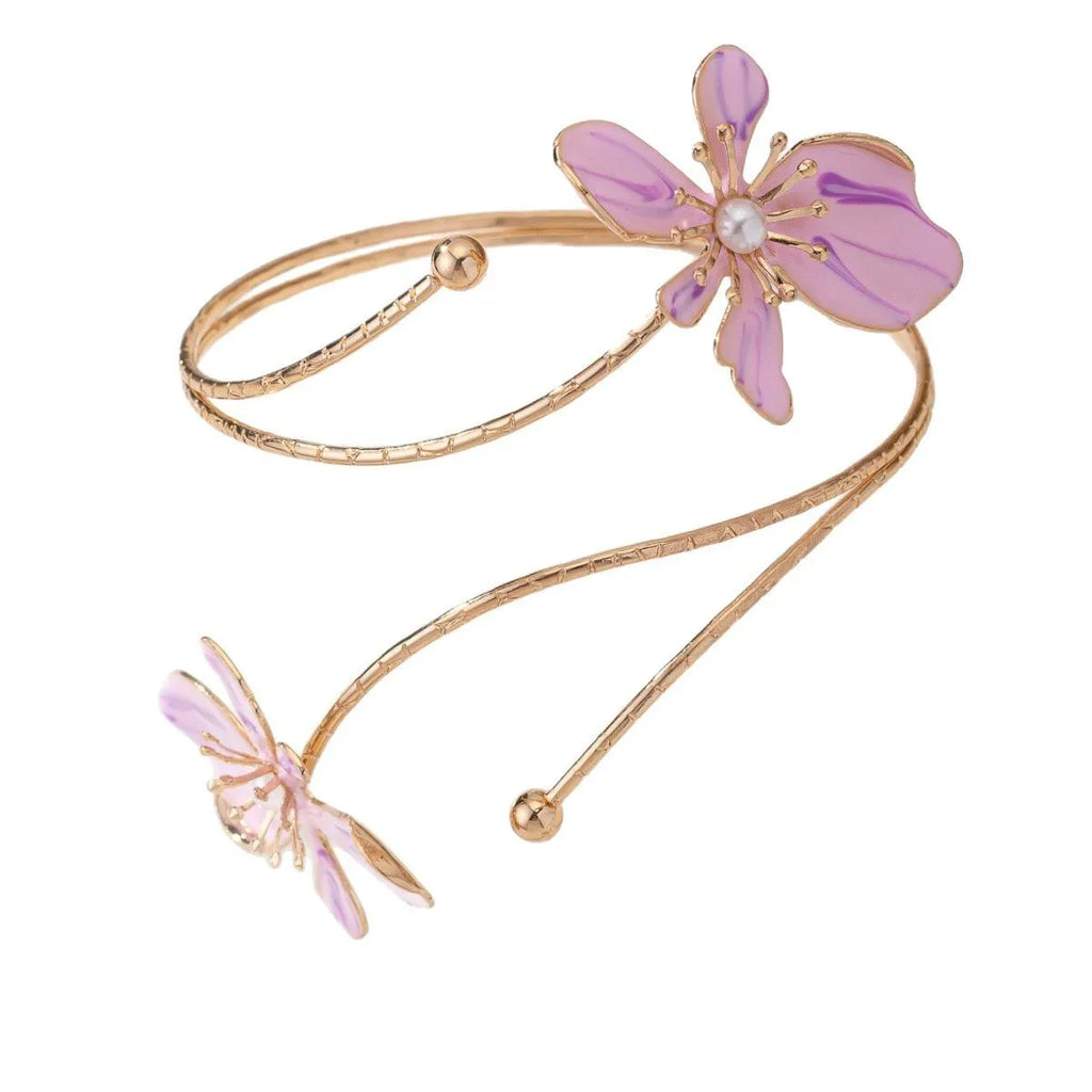 Pink hollow-out pattern alloy armband with adjustable lines on a wrist.