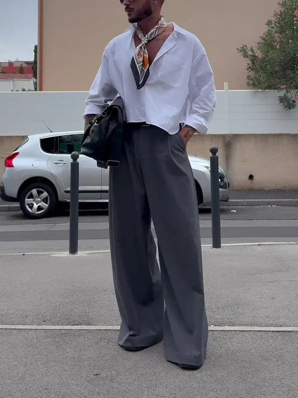 White men's casual polyester shirt with cropped top length on a hanger