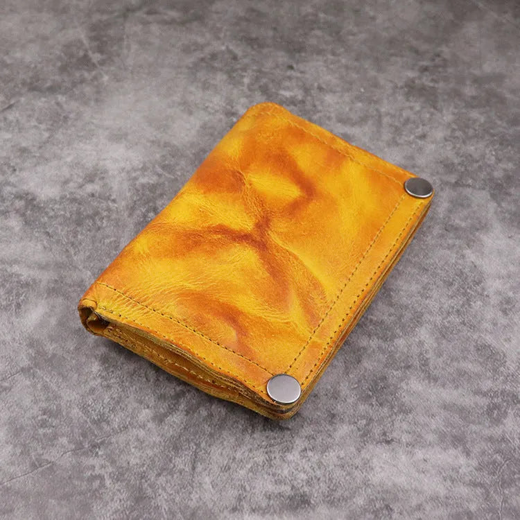 Men's retro-style long cowhide leather wallet open to show card slots, coin pocket, and bill compartment.