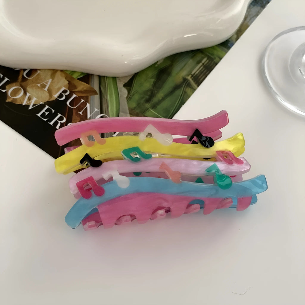 Acrylic candy color wave mixed colour notes hair grip with irregular shape on a background