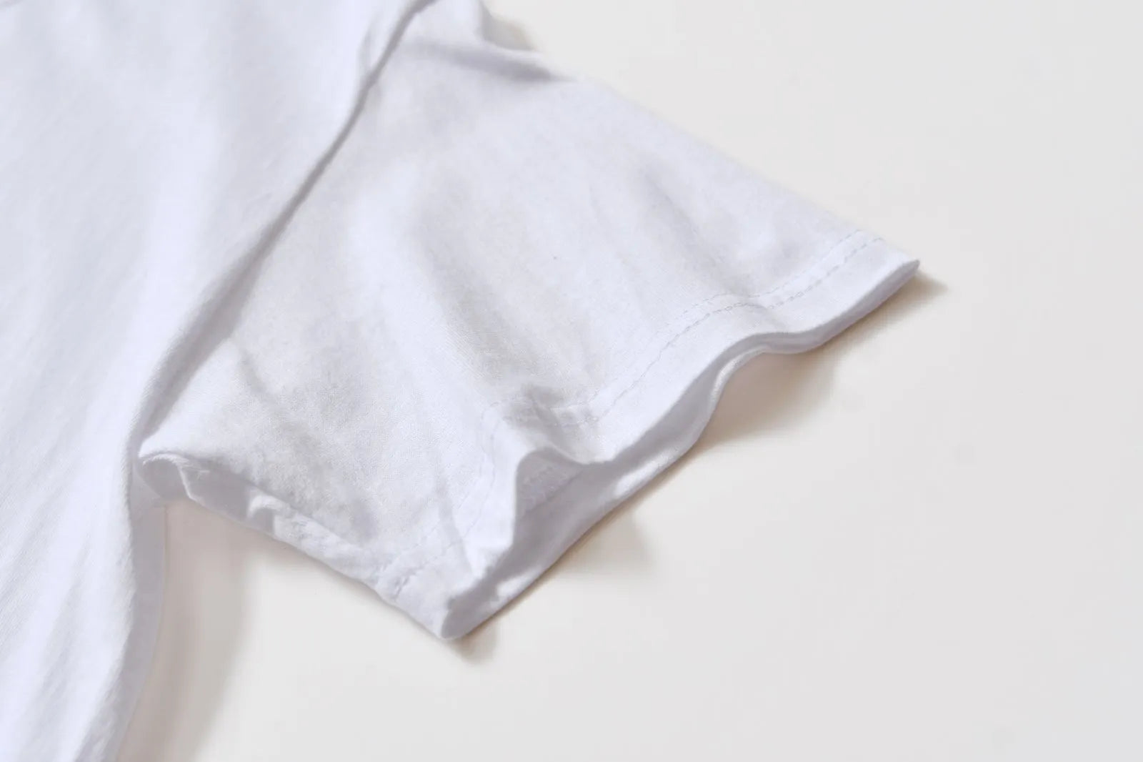 White cotton t-shirt overalls with round neck and short sleeves in loose fit