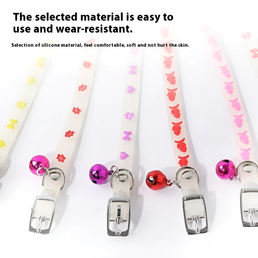 Luminous cat collar with glowing effect, silicone chain, metal bell, in a paw print pattern design.