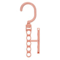 Blue revolving plastic wardrobe hanger with five branches and a central handle.