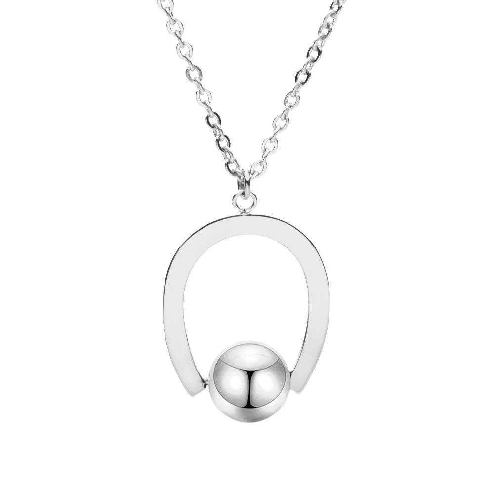 Stainless steel geometric pendant necklace on a cross chain, shown in a gold colour finish.
