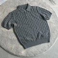 Men's twisted knit cotton short sleeve T-shirt in grey, shown on a hanger.