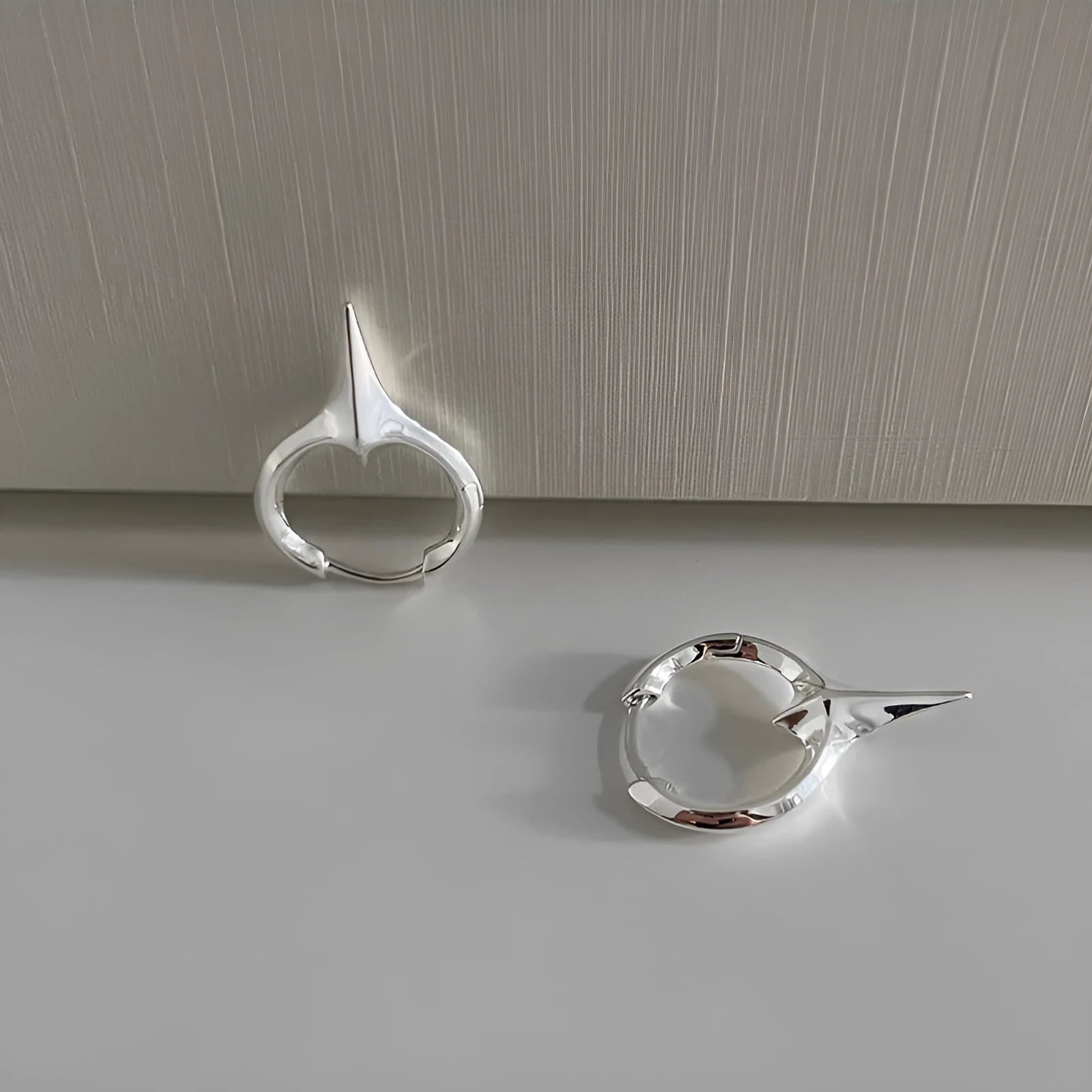 Geometric star-shaped ear clips for women with electroplated copper construction and metallic finish