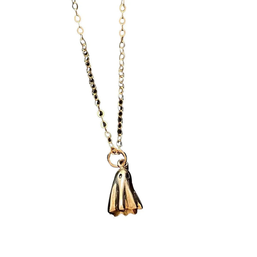 Stainless steel ghost pendant necklace on a twisted chain, showing titanium steel charm.