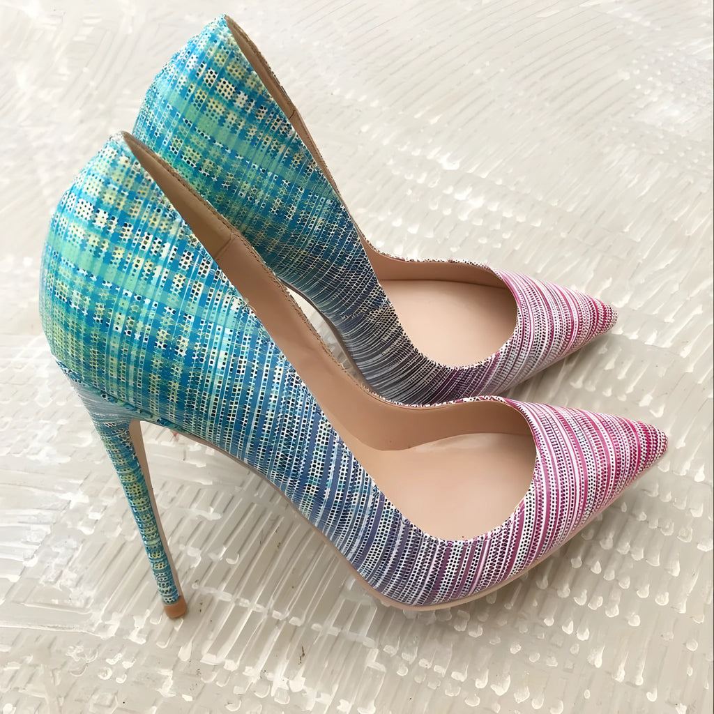 Women's pink to blue gradient patent leather pointed-toe high heels with a high stiletto heel on a rubber sole.