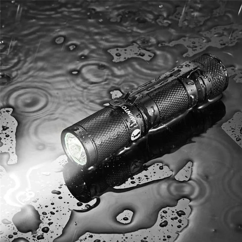 Black Lumintop Tool AA2.0 compact aluminium flashlight with keychain and magnetic tail cap.