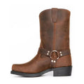 Men's brown vintage cowboy boots with a large metal buckle ring on the high top.