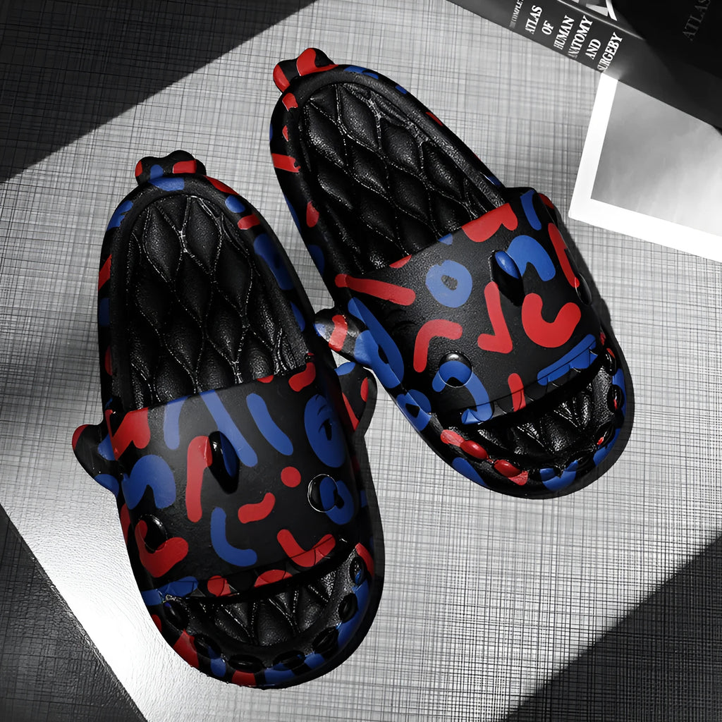 Pair of light beige shark-shaped EVA foam slippers for couples on a wooden floor