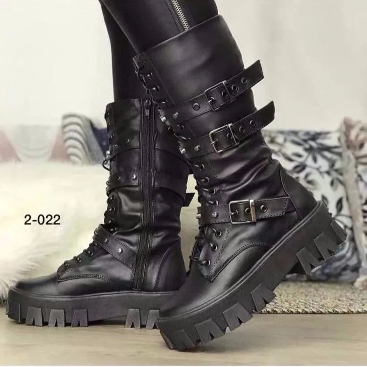 A pair of black women's mid-calf boots with a side zip and a round toe, showing the metal buckle detail.
