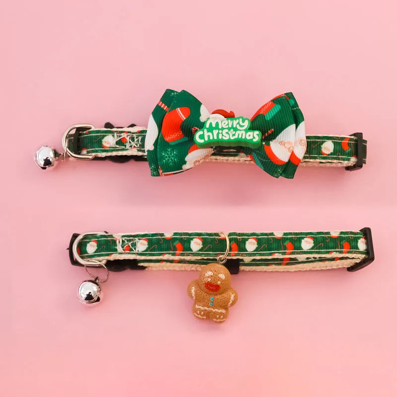 Christmas pet collar with bow tie, bell, and adjustable strap featuring Santa Claus and tree patterns