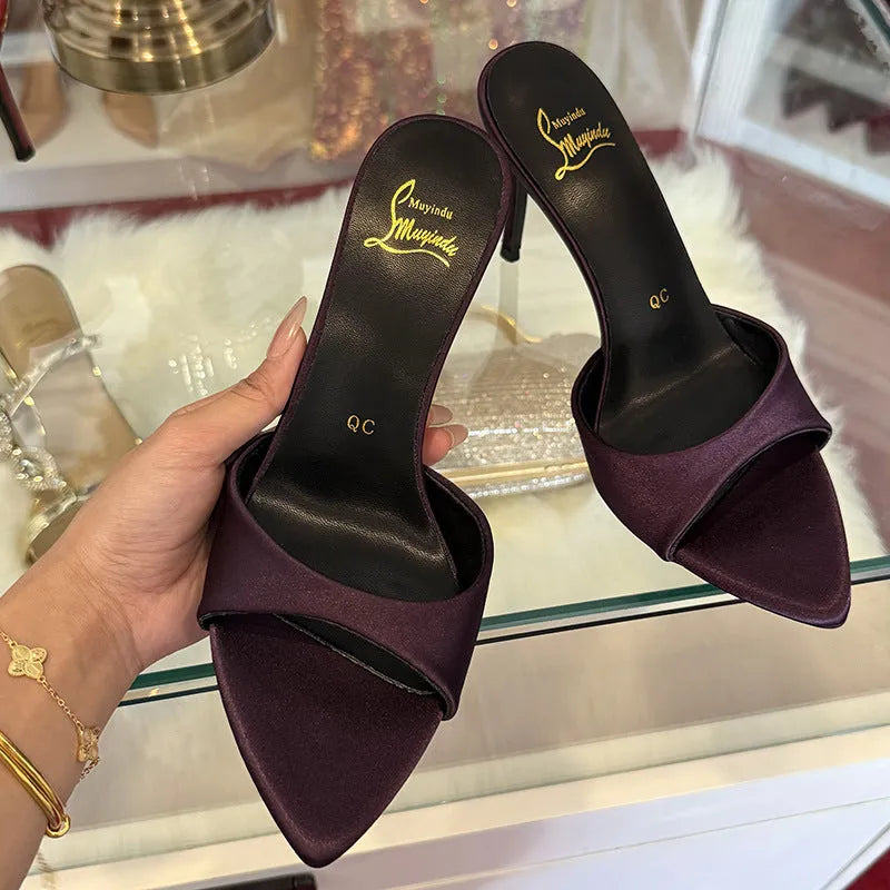 Women's black patent leather stiletto sandals with pointed toe and a high heel