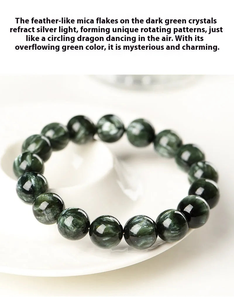 A bracelet made of polished green dragon crystal round beads with a geometric Ruyi design element.
