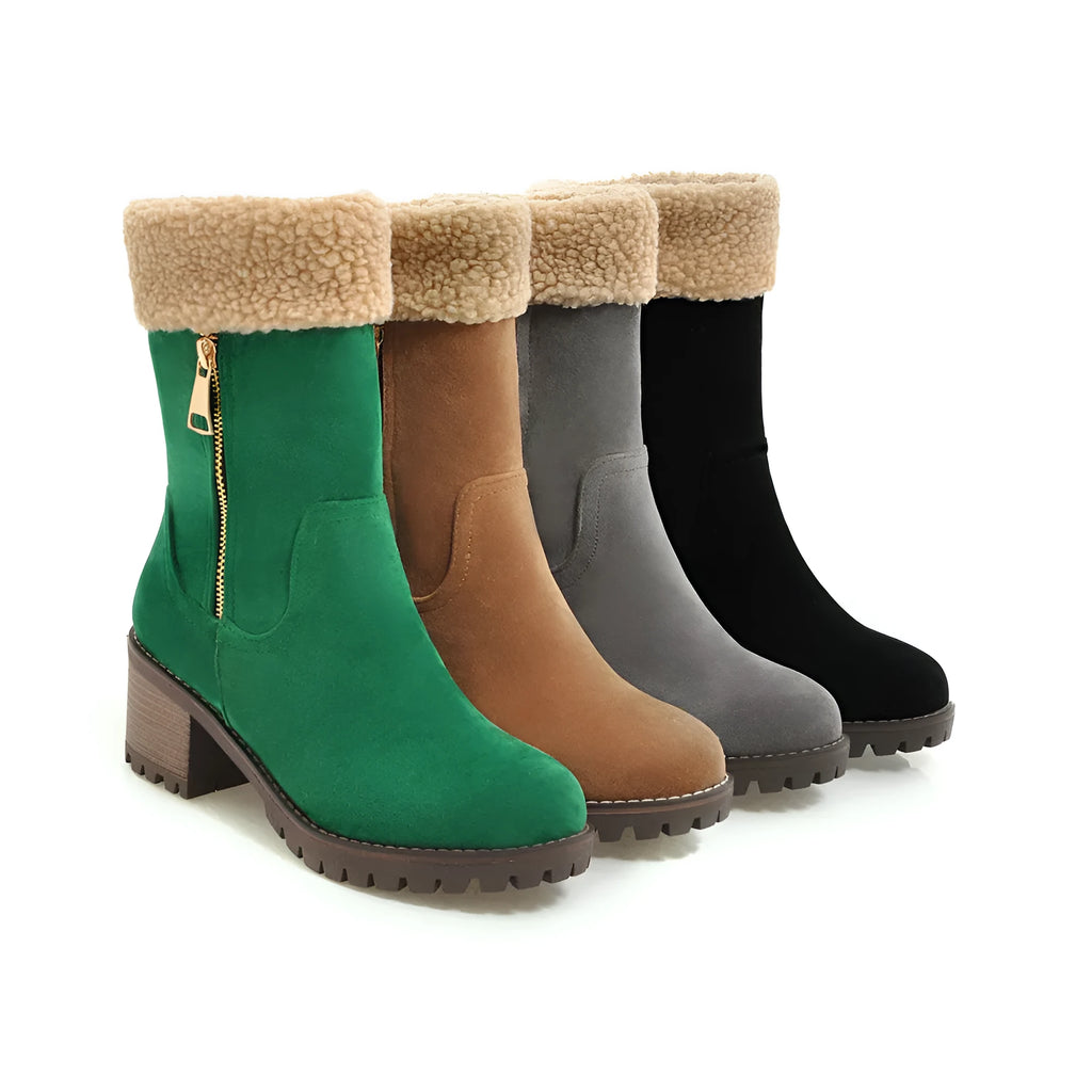 A pair of black snow boots with a plush lining and rubber insole on a winter background.