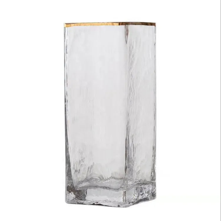 Set of three transparent gold-painted glass vases in 8x20CM, 8x25CM, and 8x30CM on a table