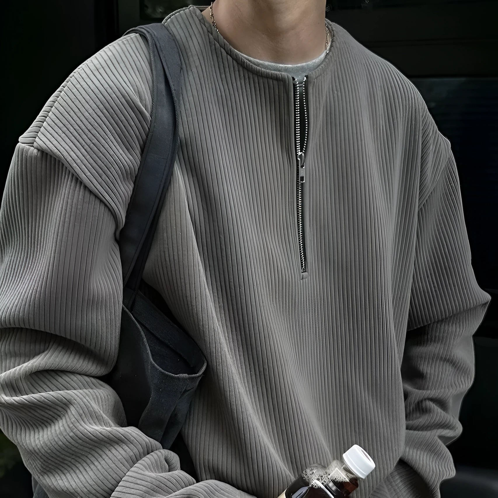 Solid colour loose fit long sleeve pullover top in grey, black, or apricot.