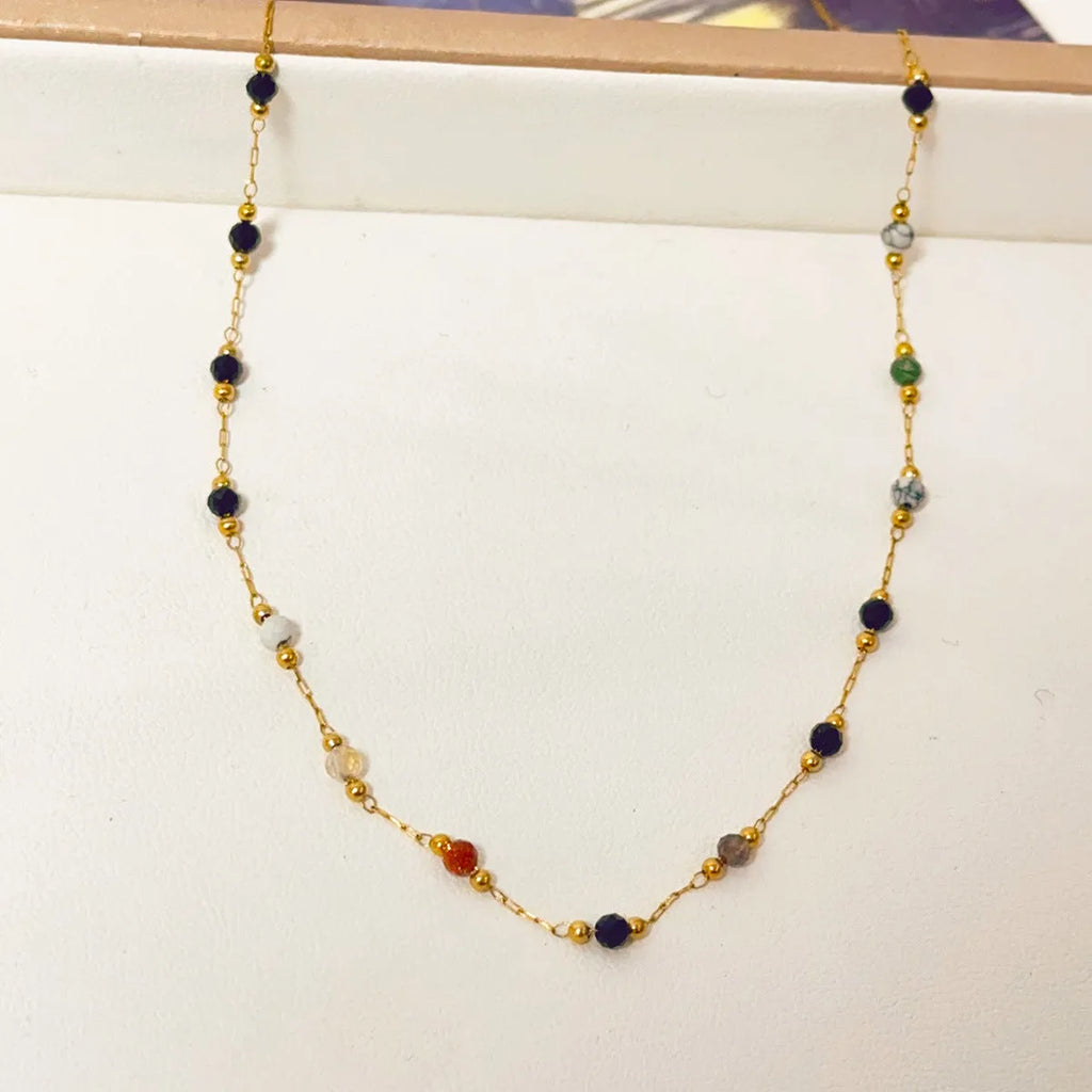 Gold titanium steel women's necklace with natural stone pendant on O-ring chain.