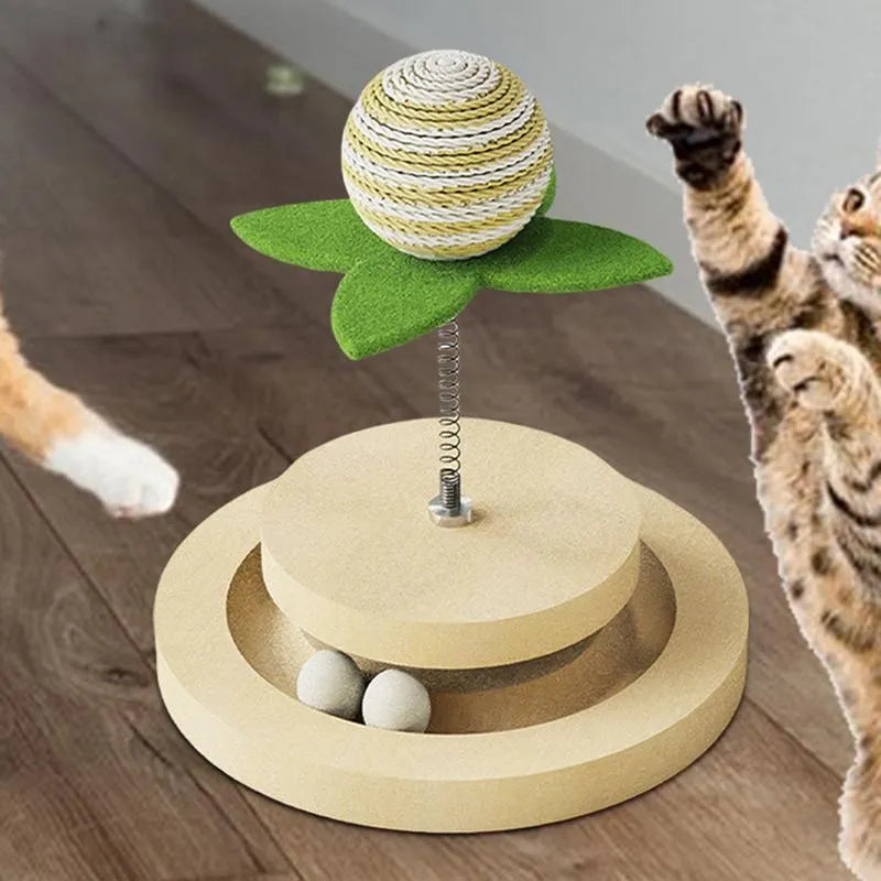 Green cat toy with a sisal scratching centre and a circular plastic ball track on a turntable.
