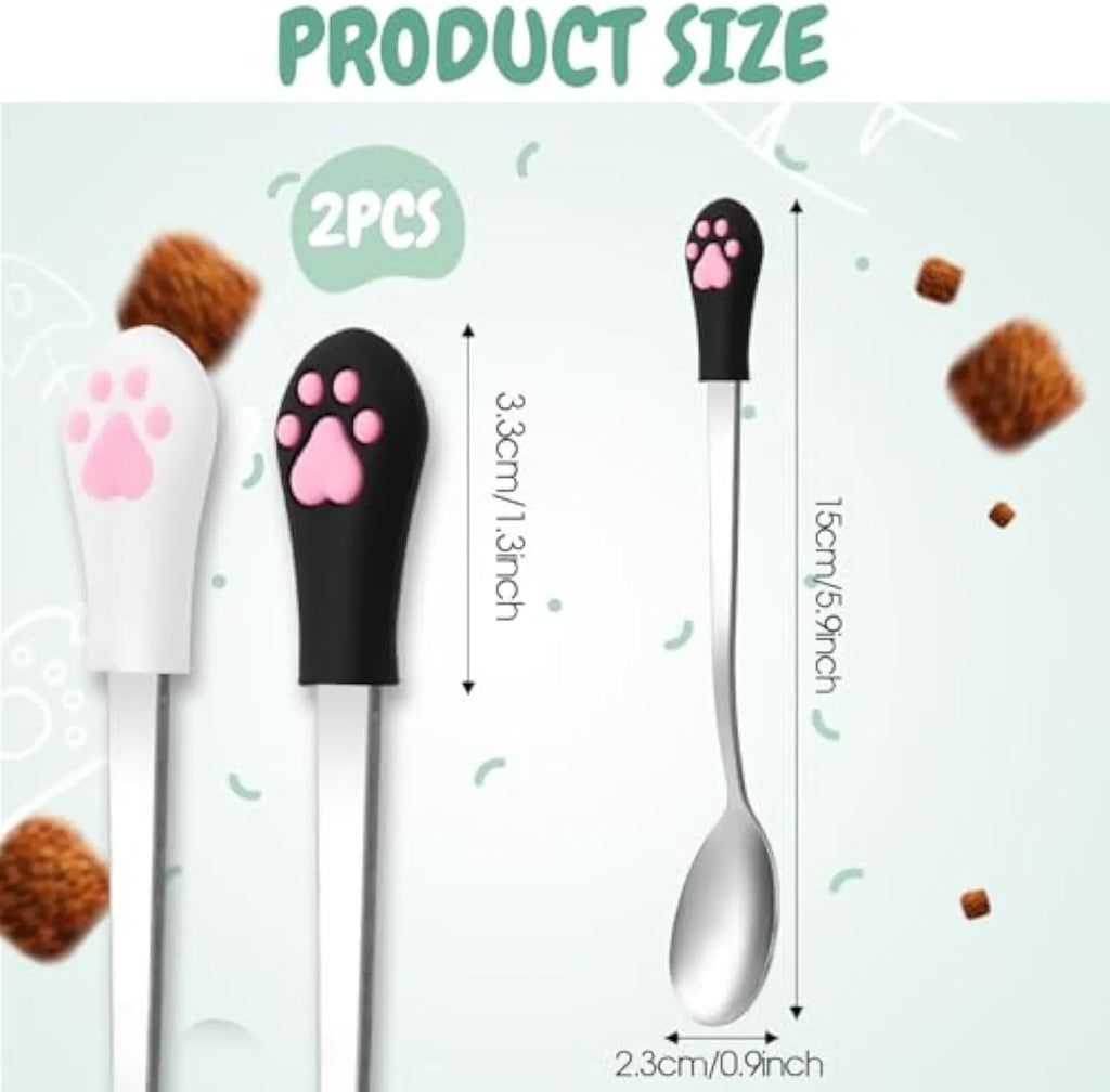 White and black pet food spoons with stainless steel heads and silicone handles showing cat paw design