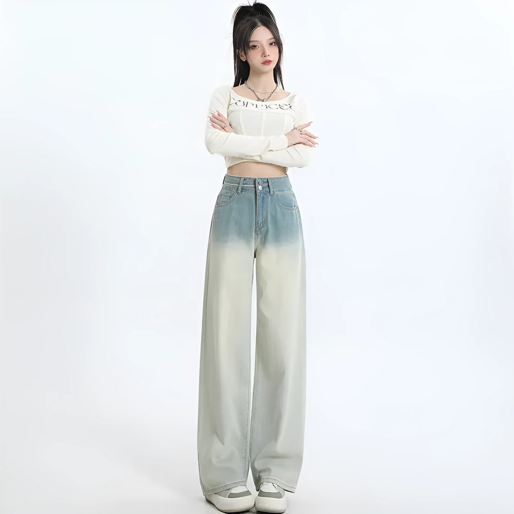 Women's gradient blue straight-leg denim trousers on a hanger, showing wide-leg silhouette.