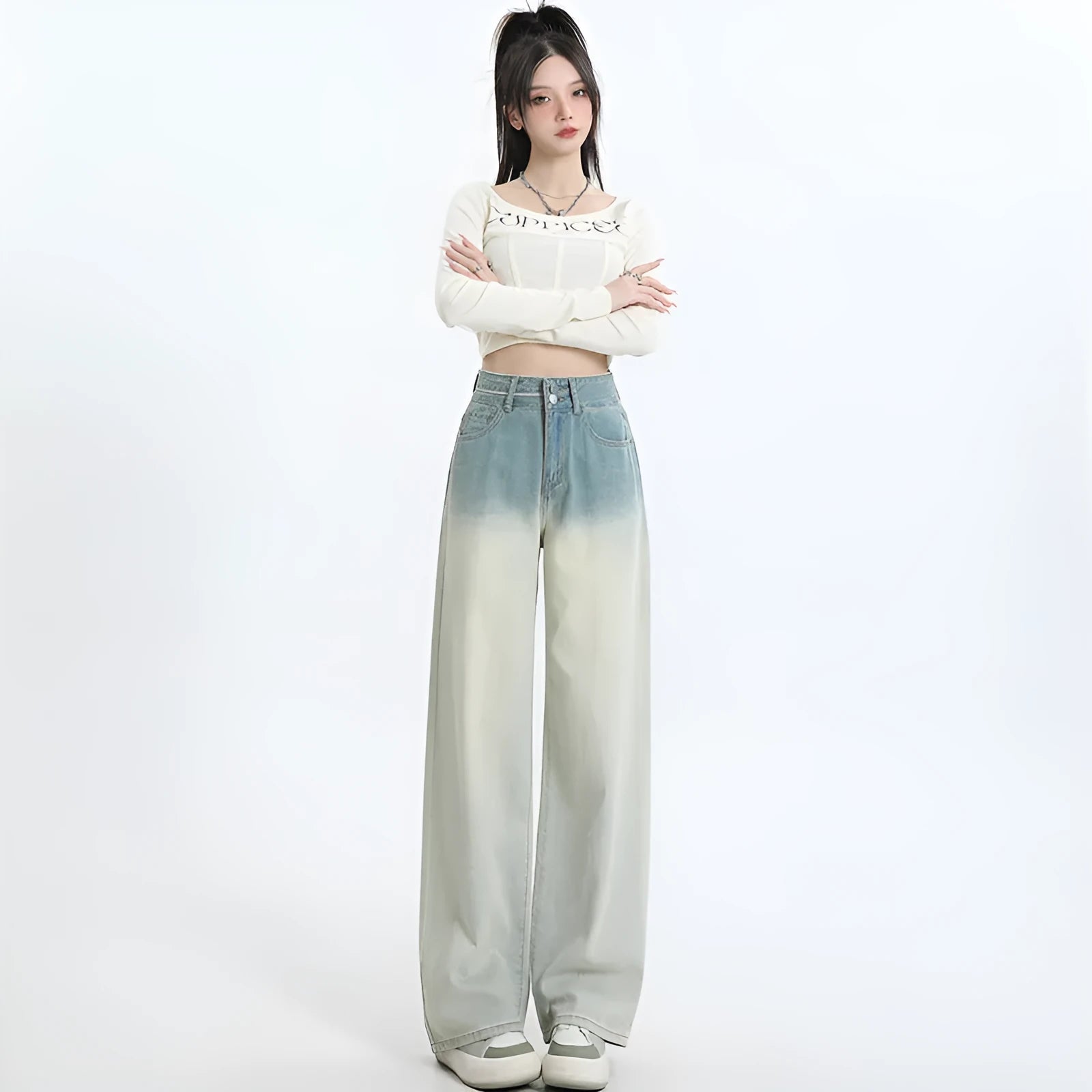 Women's gradient blue straight-leg denim trousers on a hanger, showing wide-leg silhouette.