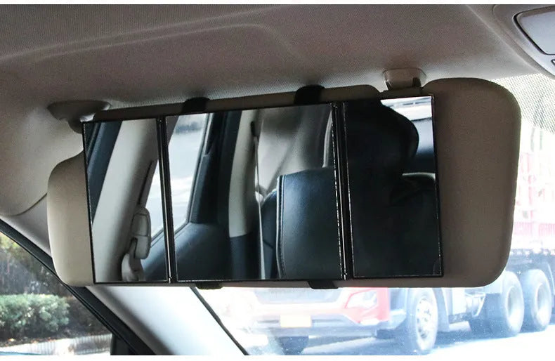Silver folding makeup mirror shown both closed and opened, next to a car sun visor.