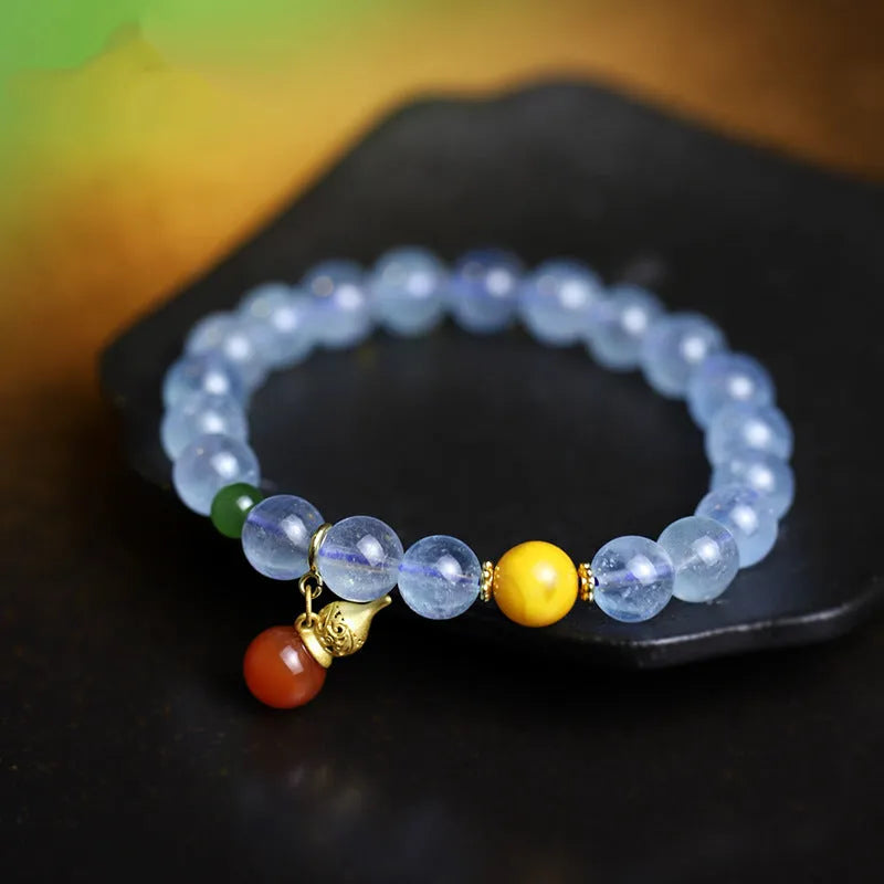 Iced aquamarine crystal bracelet with 8mm geometric beads and retro ethnic styling details