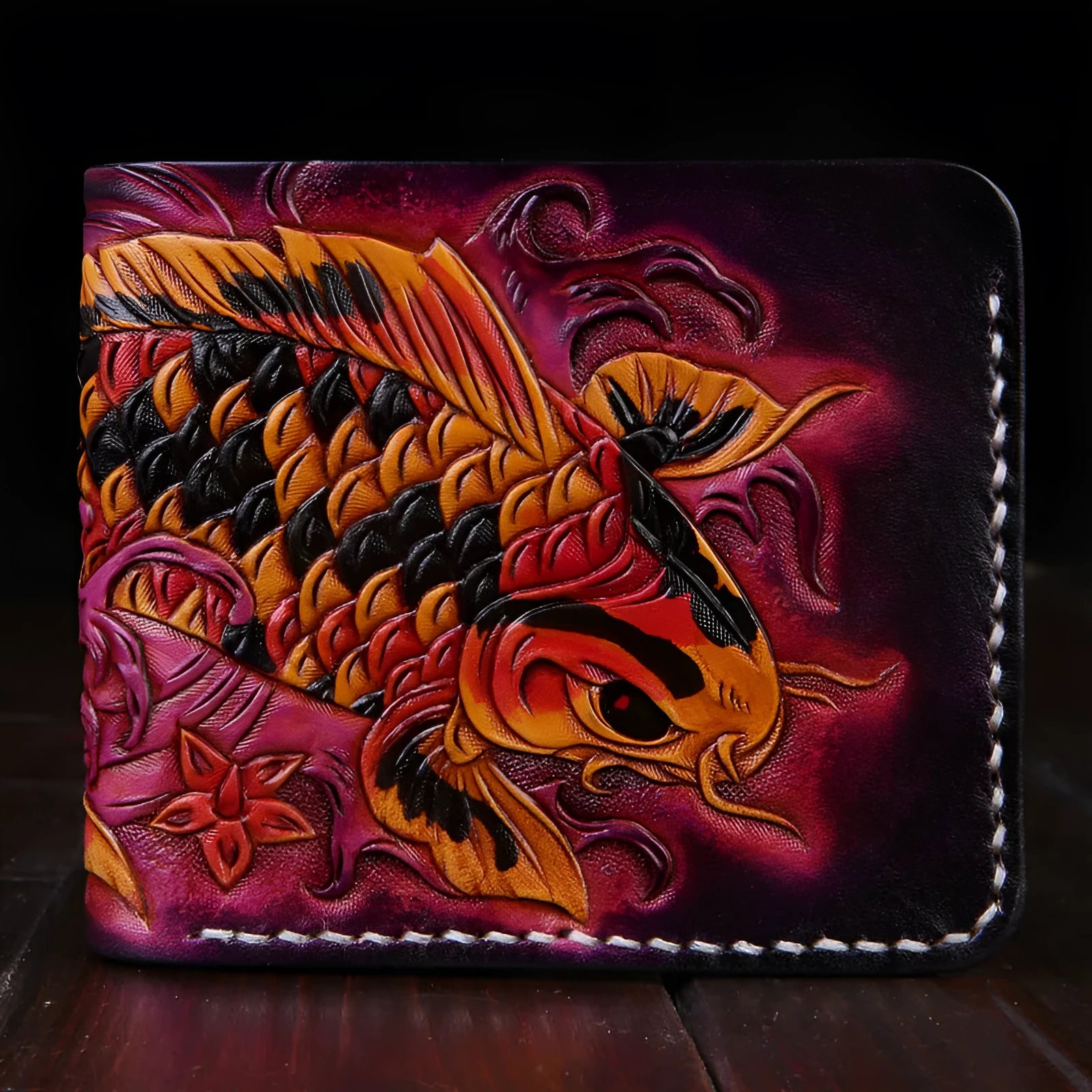 Men's solid colour leather short wallet with manual carving detail, shown in blue, red, and gold.