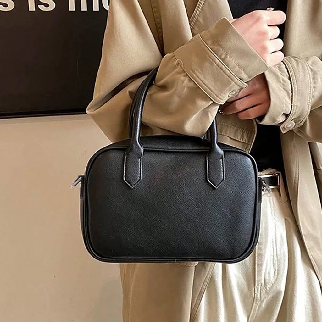 Small square retro messenger bag in black or coffee colour with single shoulder strap