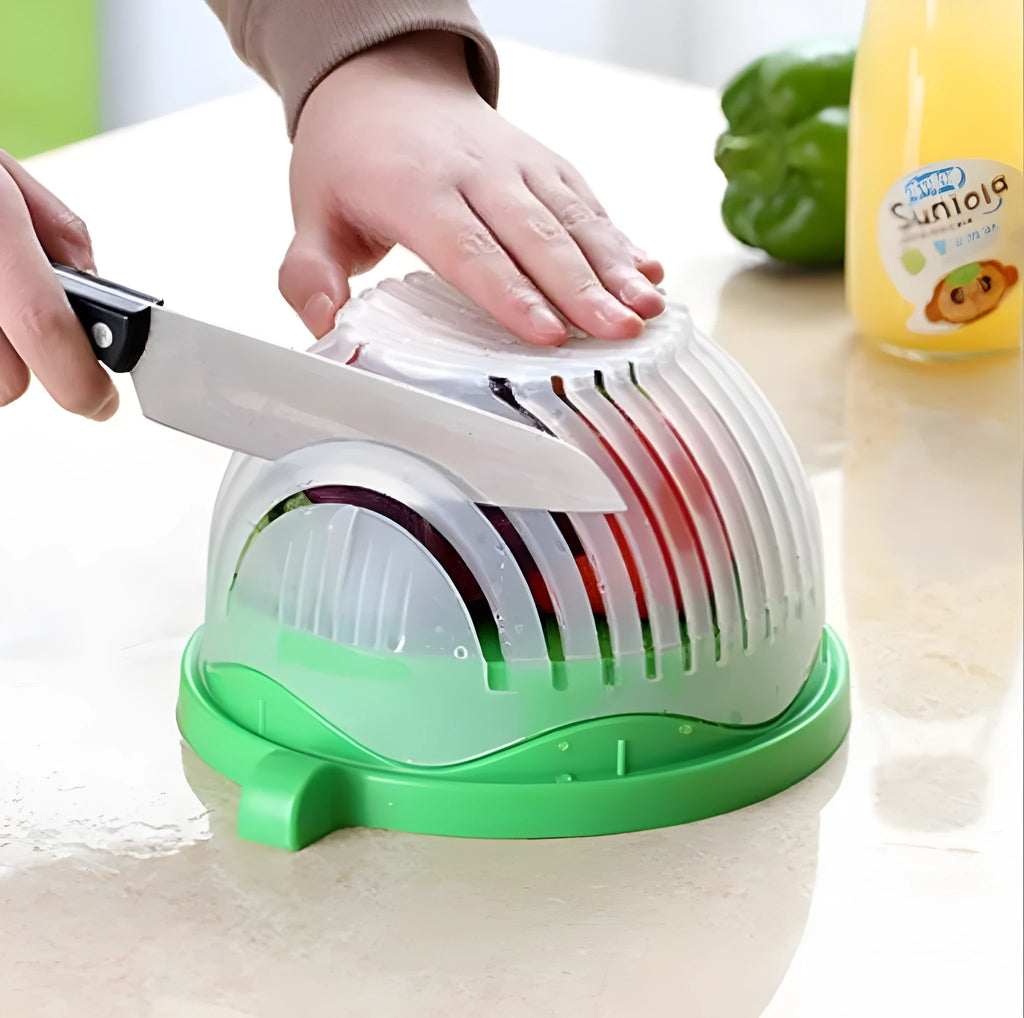 Blue salad cutter bowl showing removable cutting lid placed on a base with a raised rim.