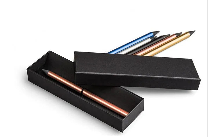 Silver Inkless Metal Pen with 0.5mm alloy tip, spare nib, and pen bag on wooden desk