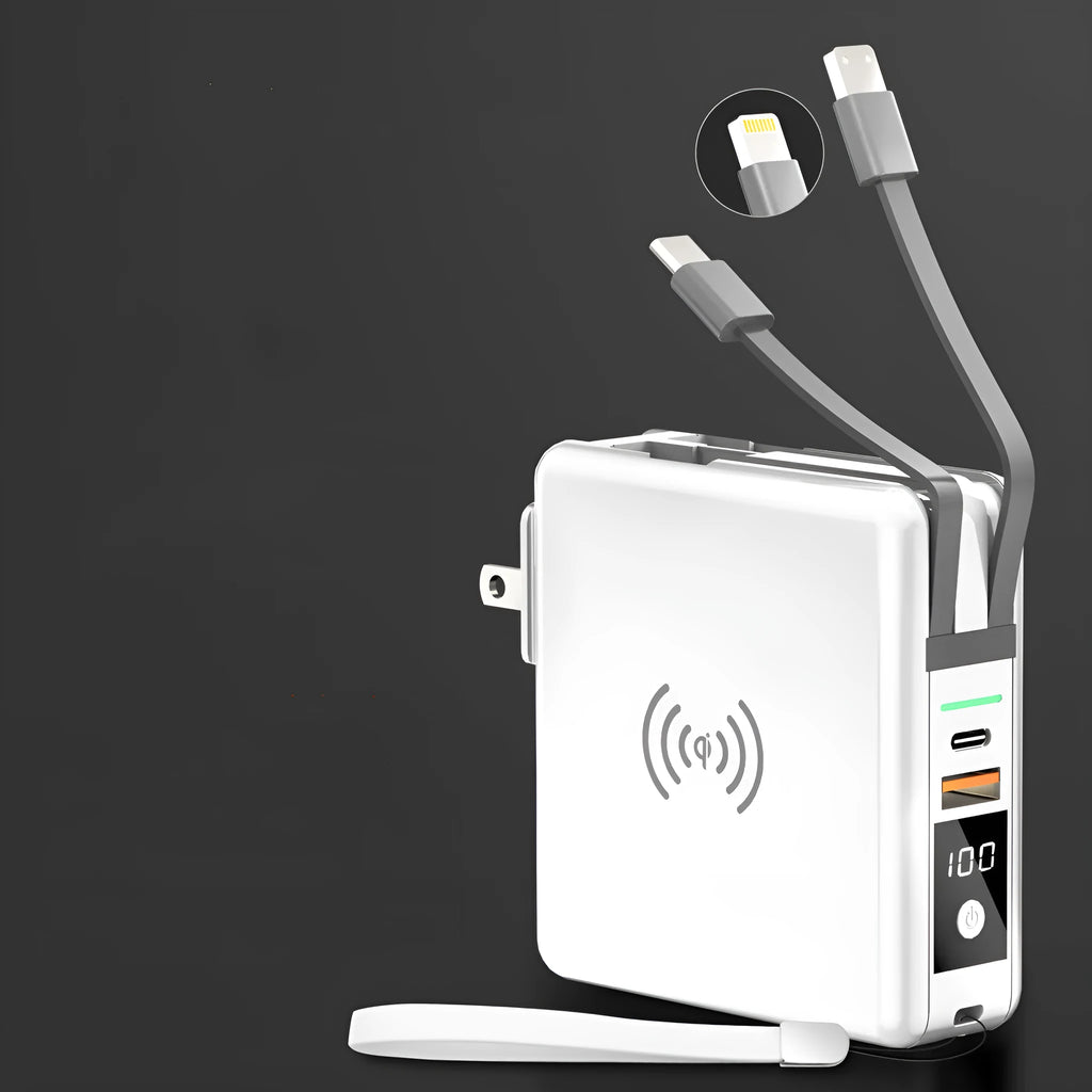 Black Super QI wireless power bank with integrated folding plug shown on a table next to a smartphone.