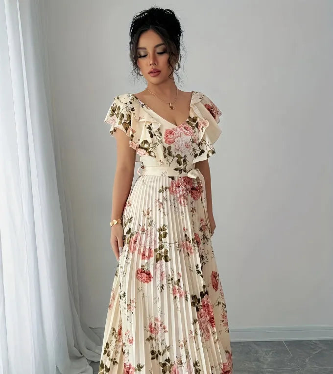 Apricot coloured V-neck floral print dress with ruffled sleeves and an oversized swing skirt