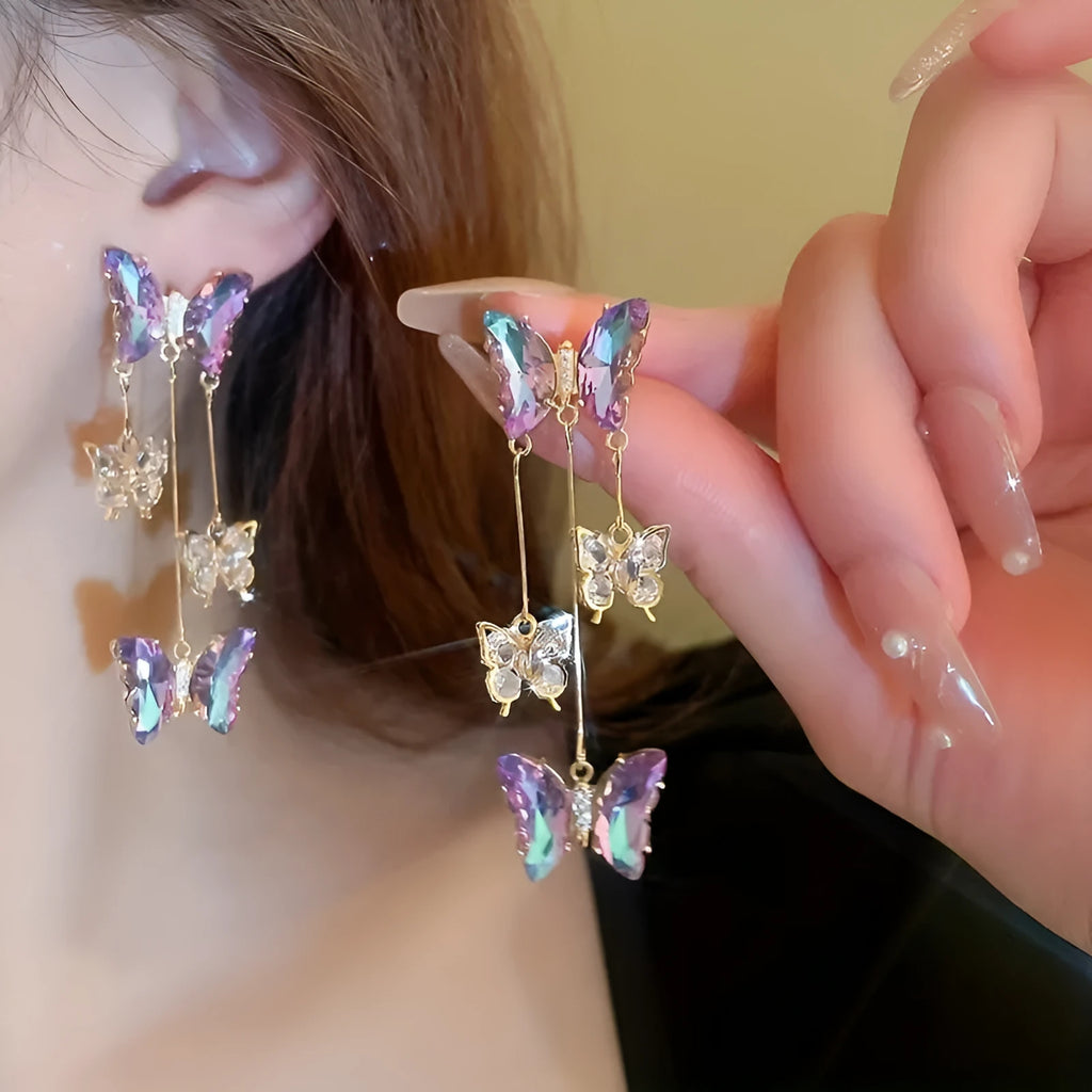 Silver Needle blue purple butterfly tassel earrings with crystal flowers on alloy chains, showing 7cm drop length.