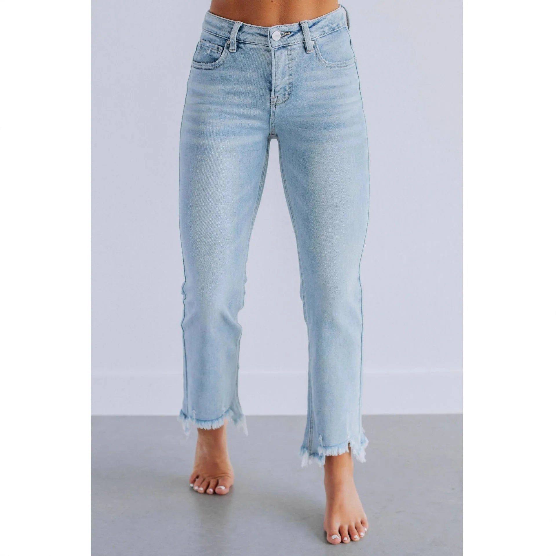 Women's solid colour denim pants with hand-worn distressing in dark blue and light blue.