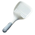 White plastic cat litter scoop with an attached storage base on a white background.