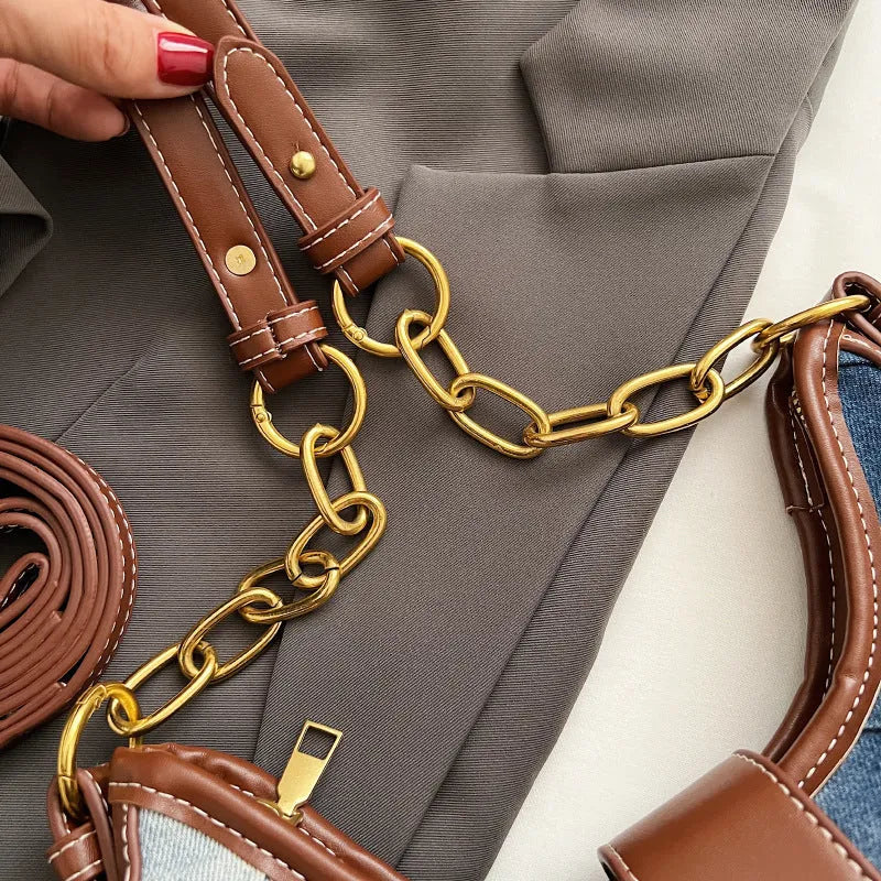Brown denim women's bucket shoulder bag with diamond mesh detail and a chain strap.